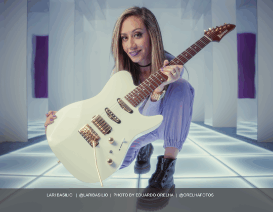 Lari Basilio featured in the March 2025 Guitar Girl Magazine calendar holding her Ibanez LB1 Lari Basilio Signature Electric Guitar in White