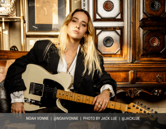 May page of the 2026 Guitar Girl Magazine calendar featuring guitarist Noah Vonne seated indoors while holding a Fender electric guitar.
